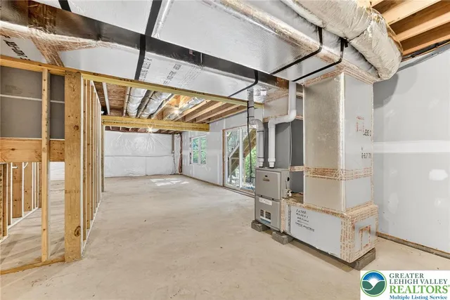 a view of a garage with wooden table and chairs
