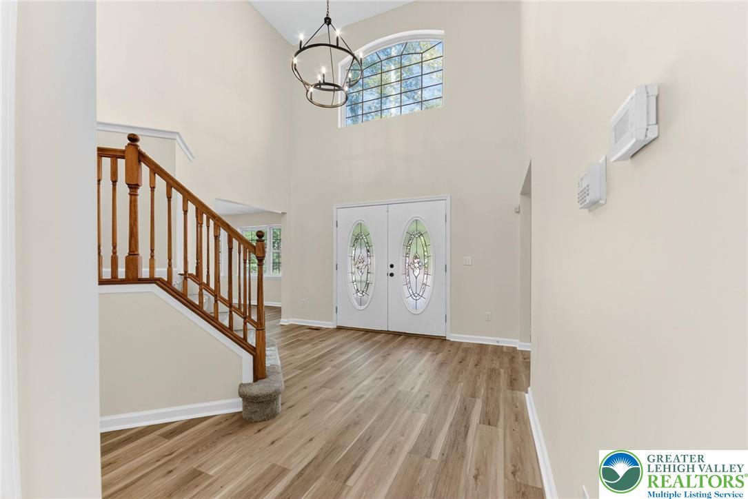 45 Coach Road Stroudsburg, PA 18360 - Photo 4 of 44 a view of a hallway with wooden floor and staircase