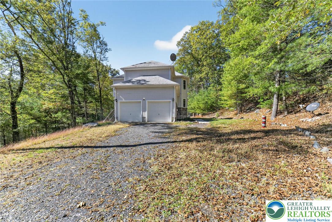 45 Coach Road Stroudsburg, PA 18360 - Photo 42 of 44 a view of a dry yard with large trees