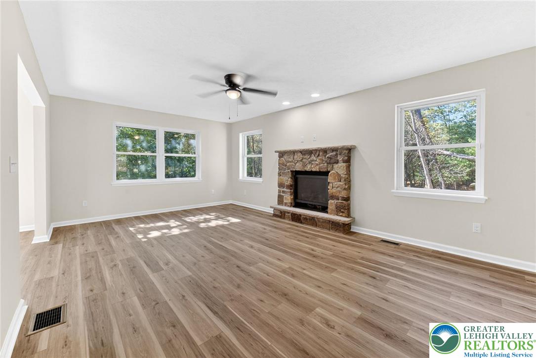 45 Coach Road Stroudsburg, PA 18360 - Photo 5 of 44 a view of empty room with wooden floor and fireplace