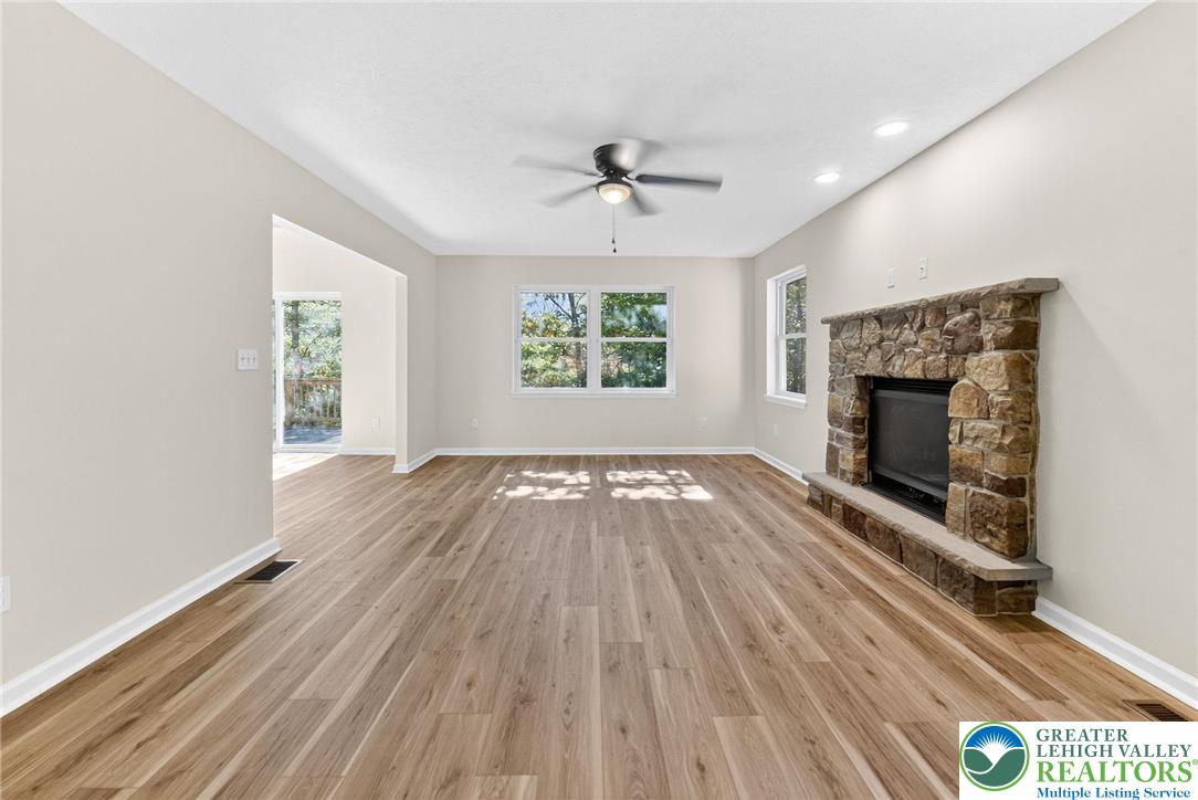 45 Coach Road Stroudsburg, PA 18360 - Photo 8 of 44 wooden floor in an empty room with a fireplace