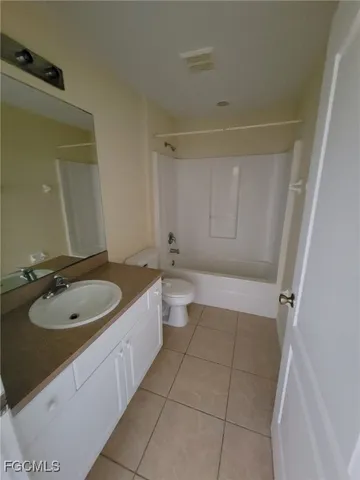 a bathroom with a sink a toilet and tub