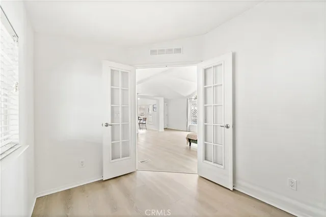 an empty room with large window