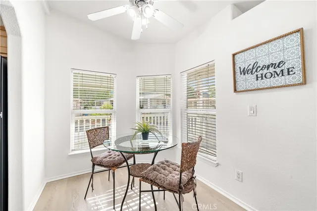 a view of a dining room with furniture and window