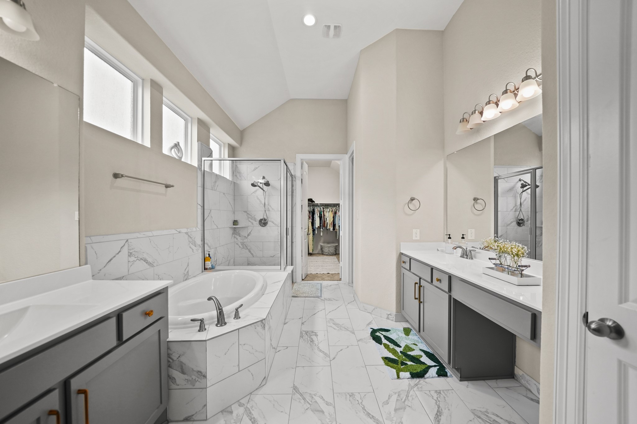 24031 Corinaldo Court Katy, TX 77493 - Photo 12 of 23 a spacious bathroom with a sink double vanity and a mirror