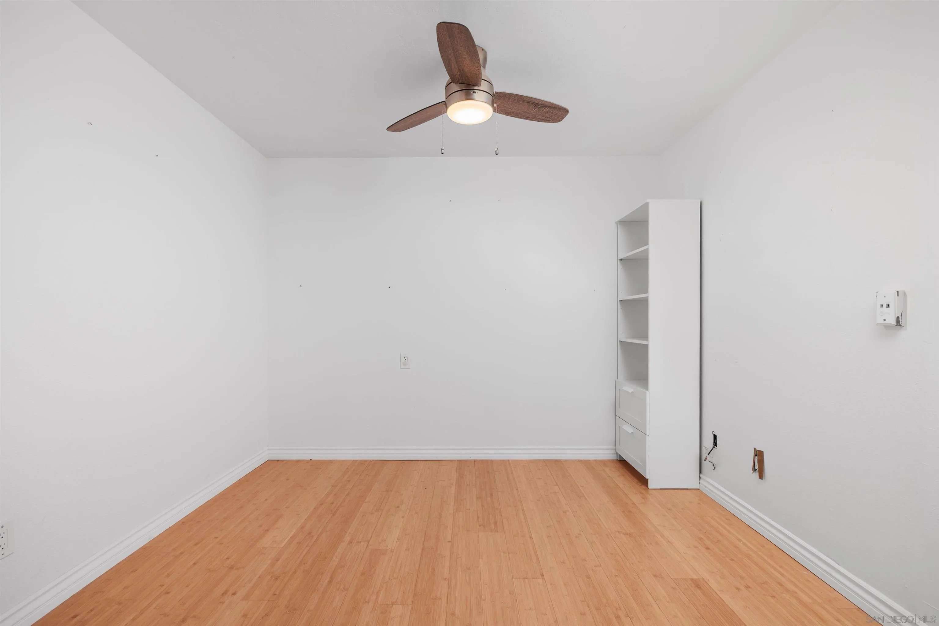 407 Requeza Street, Unit E9 Encinitas, CA 92024 - Photo 13 of 19 a very nice looking room with a ceiling fan