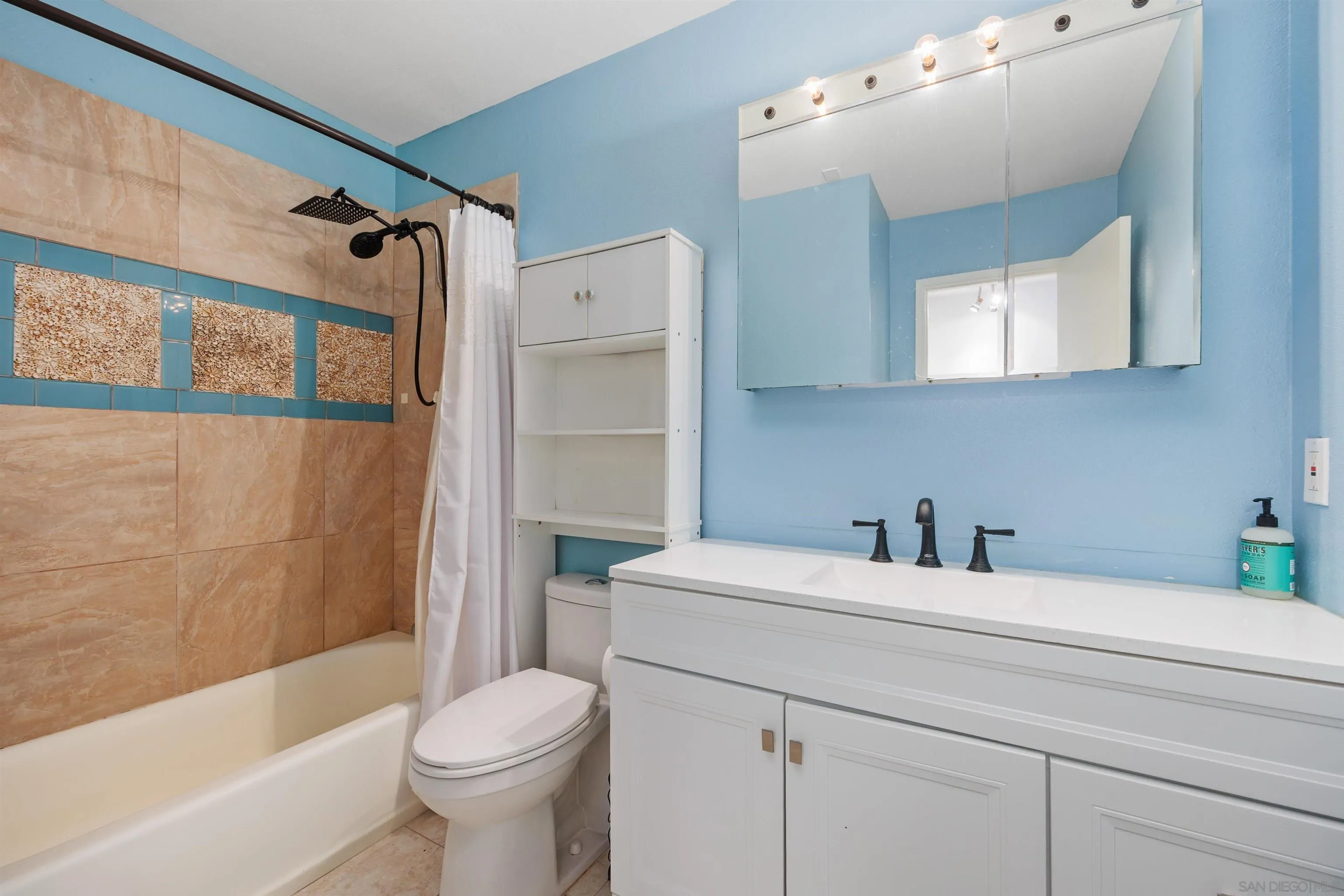 407 Requeza Street, Unit E9 Encinitas, CA 92024 - Photo 15 of 19 a bathroom with a sink toilet and shower