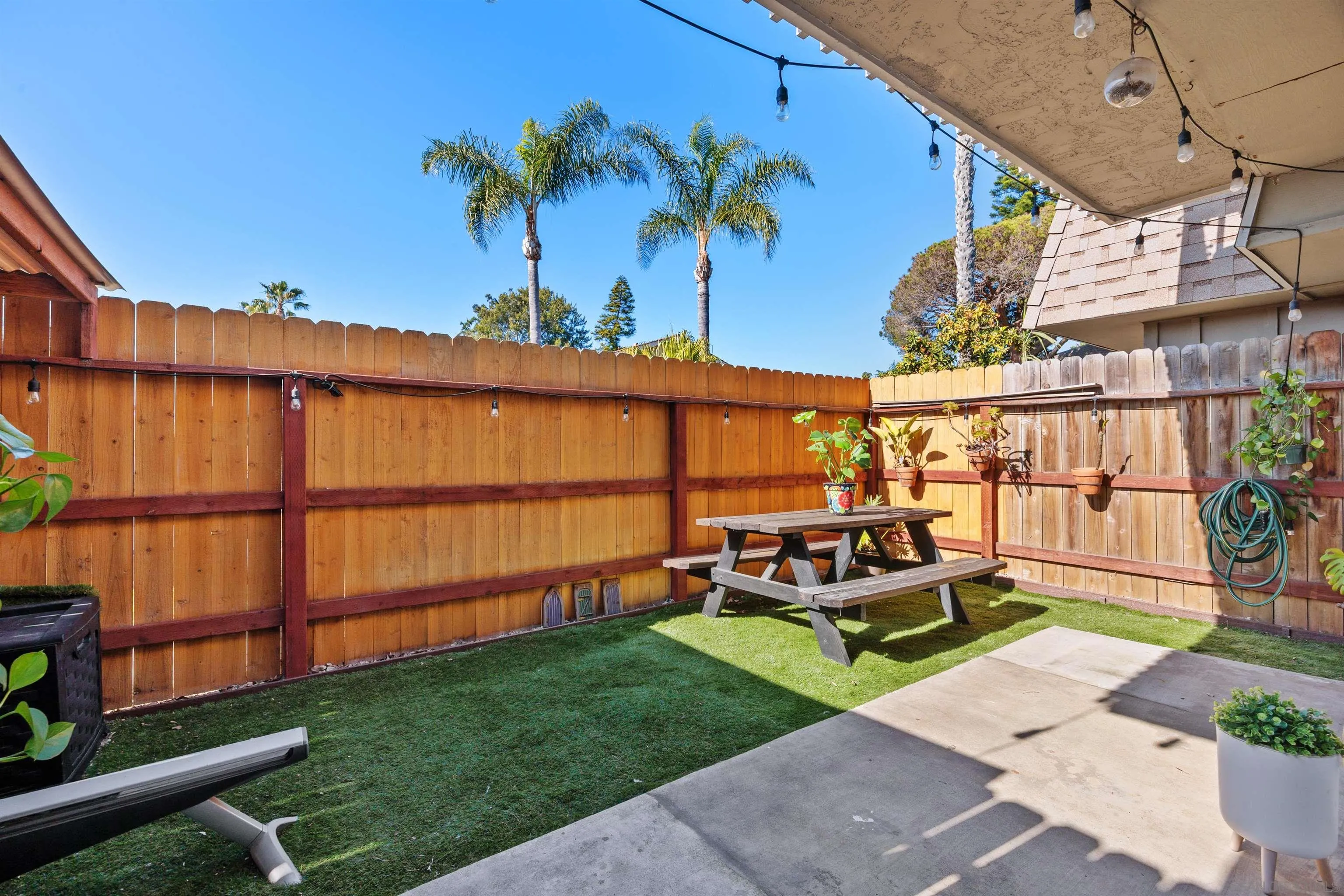 407 Requeza Street, Unit E9 Encinitas, CA 92024 - Photo 17 of 19 a view of a chairs and table in patio