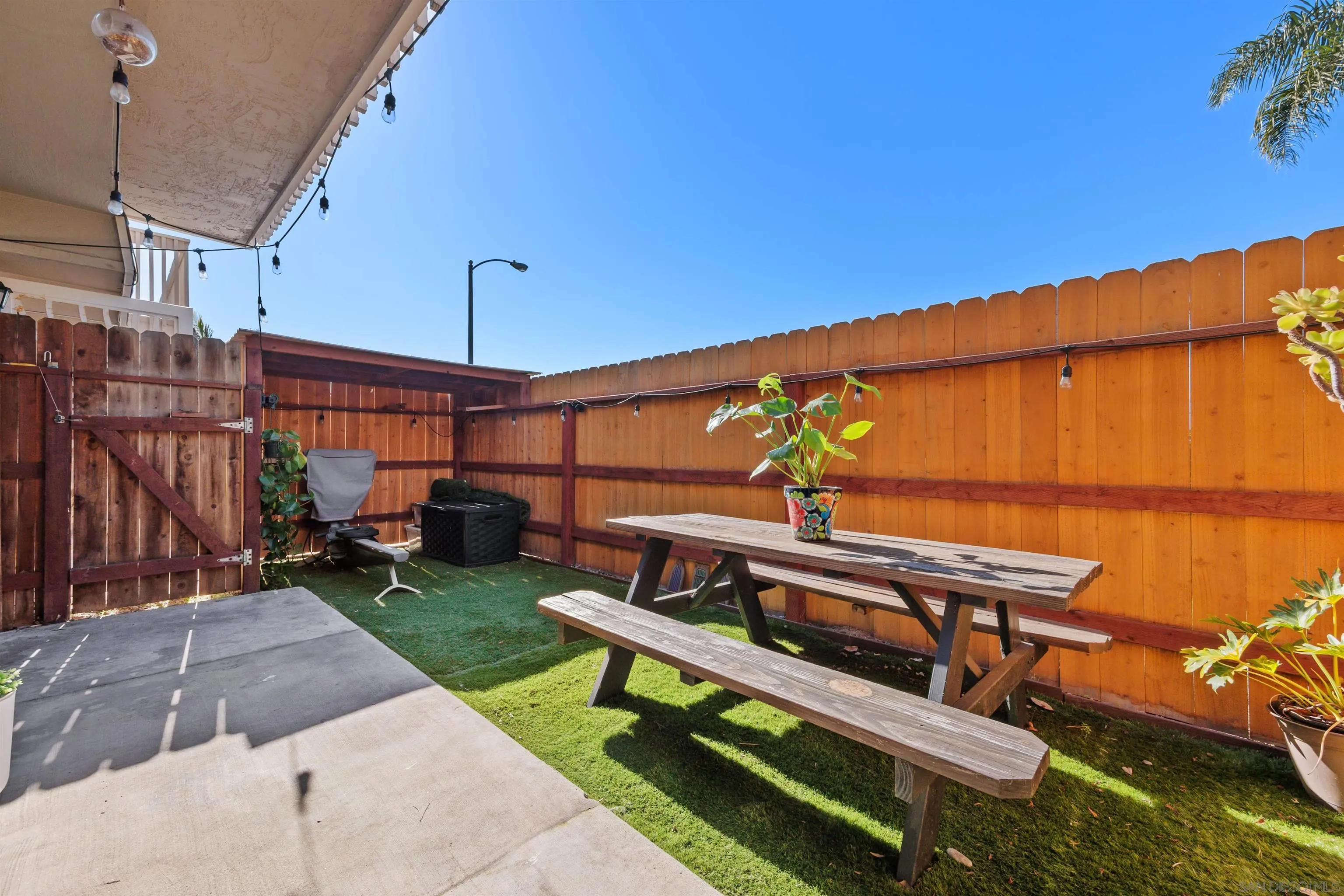 407 Requeza Street, Unit E9 Encinitas, CA 92024 - Photo 18 of 19 a view of a patio with a table and chairs