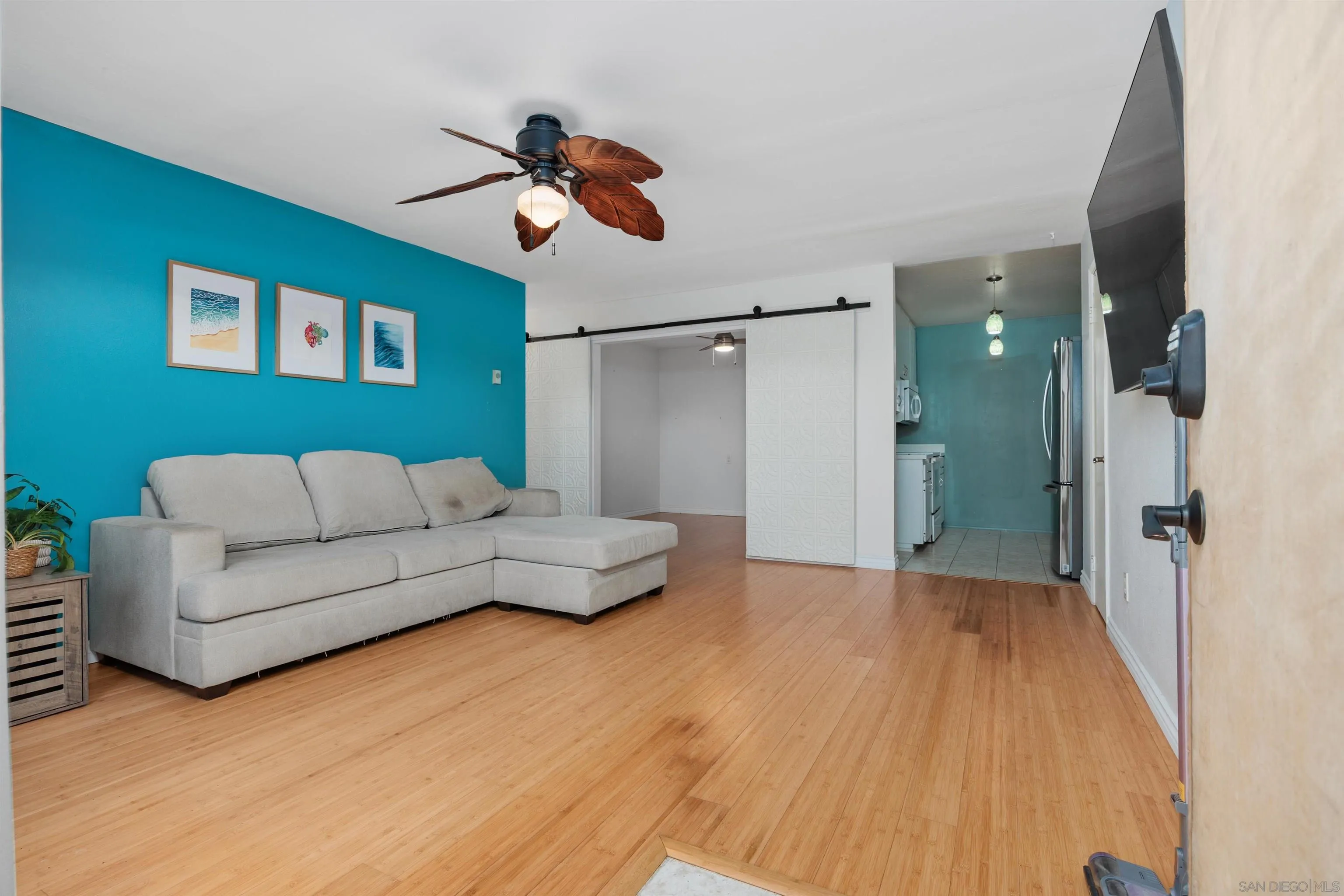 407 Requeza Street, Unit E9 Encinitas, CA 92024 - Photo 4 of 19 a living room with furniture and a wooden floor