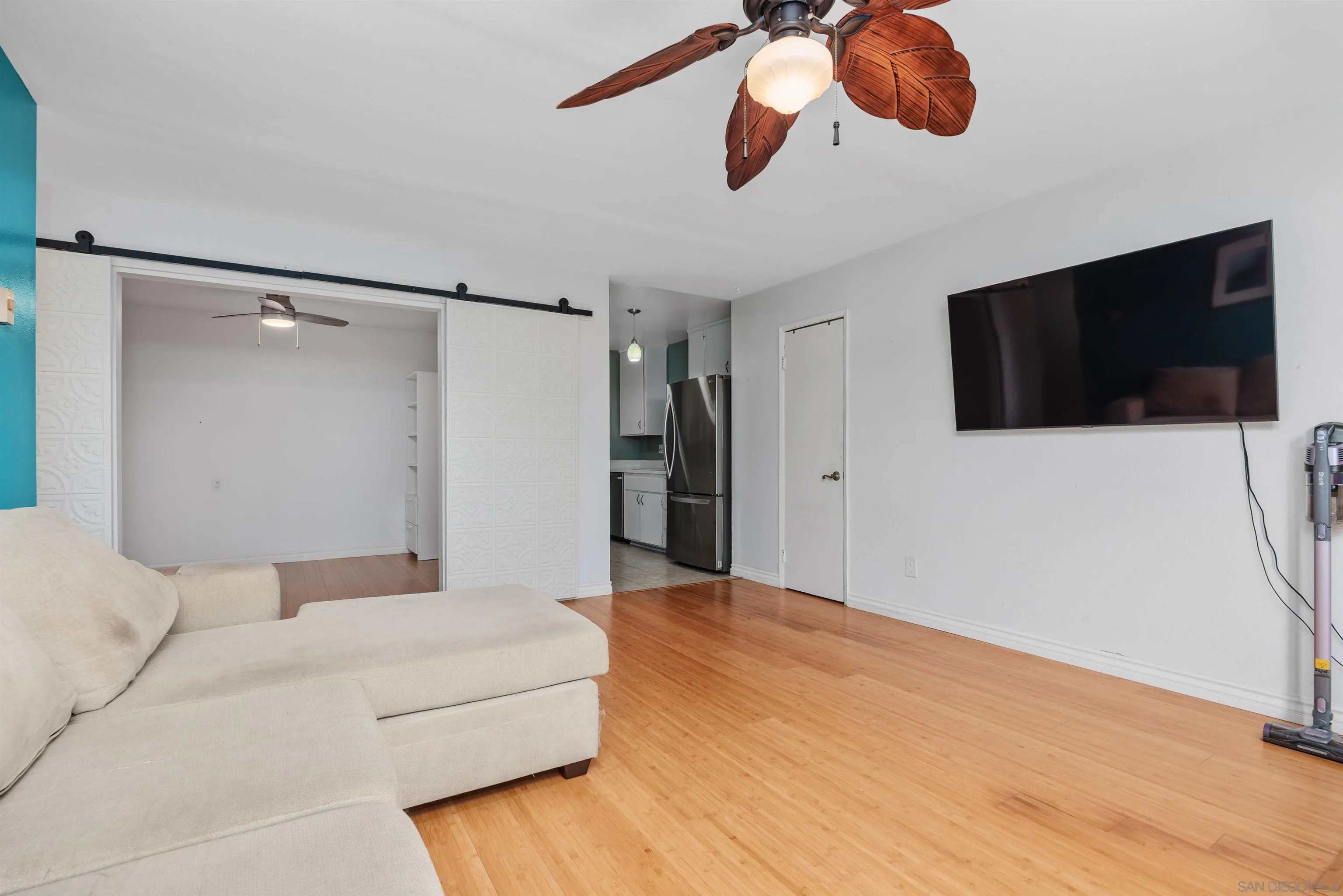 407 Requeza Street, Unit E9 Encinitas, CA 92024 - Photo 5 of 19 a view of a livingroom with a flat screen tv