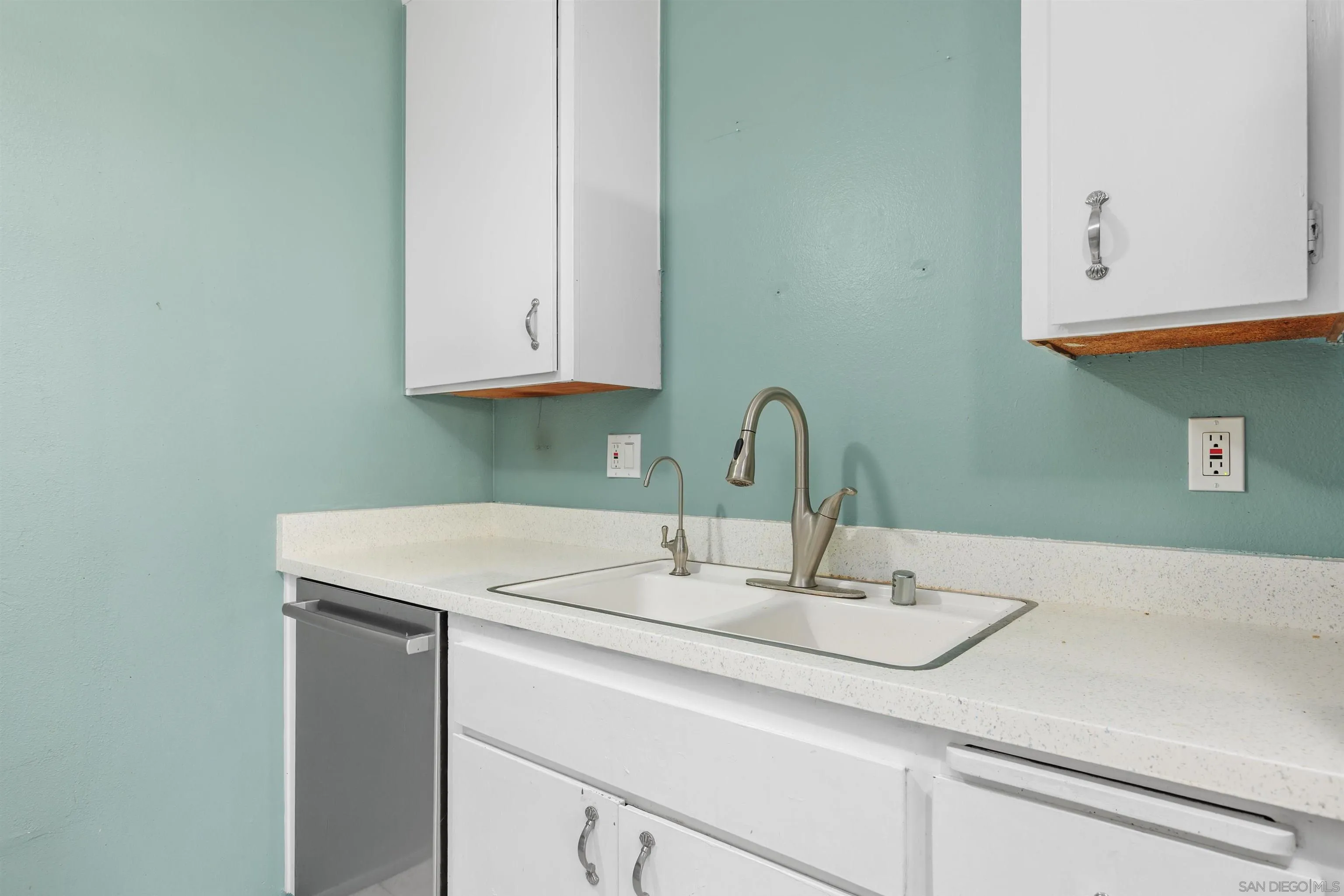 407 Requeza Street, Unit E9 Encinitas, CA 92024 - Photo 8 of 19 a close view of sink and tap