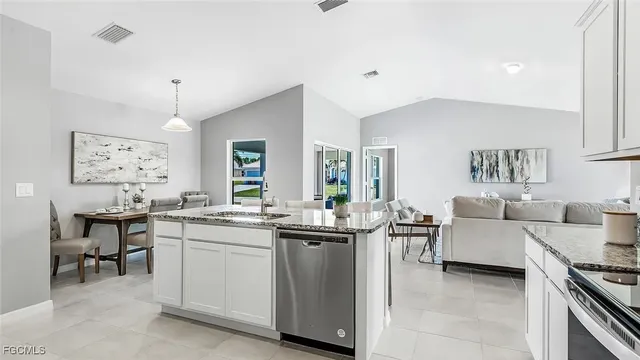 a living room with granite countertop furniture a dining table and chairs