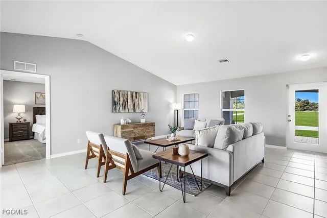 a living room with furniture and a table