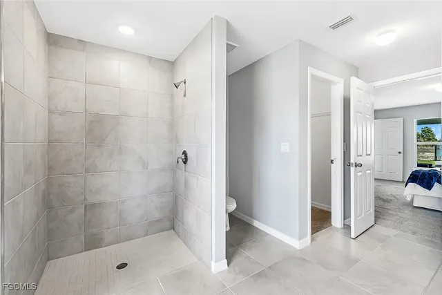 a bathroom with a shower and a tub
