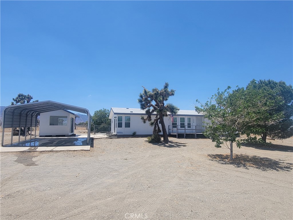 11424 Beekley Road Phelan, CA 92371 - Photo 1 of 1 a view of a house with a snow in front of it