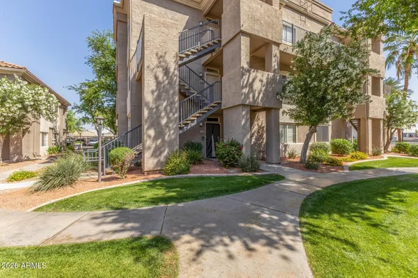 a view of a street with brick building in the background