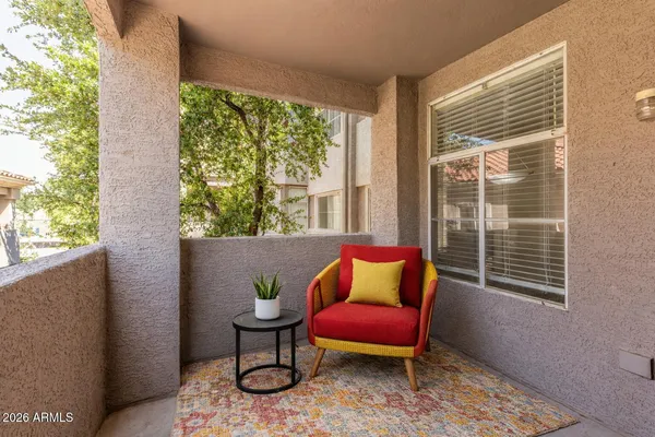a outdoor living space with furniture and a window