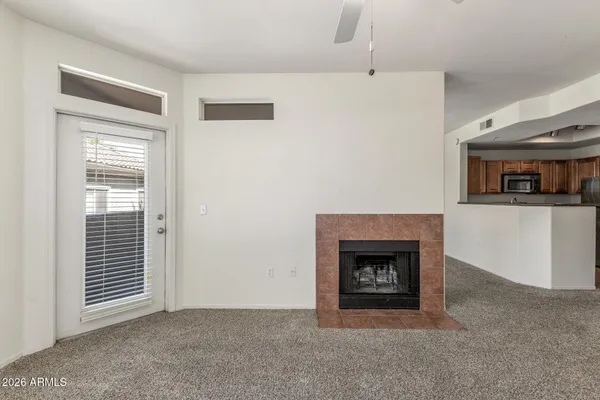 a living room with furniture and a fireplace