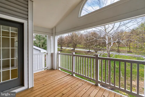 a view of balcony with wooden floor