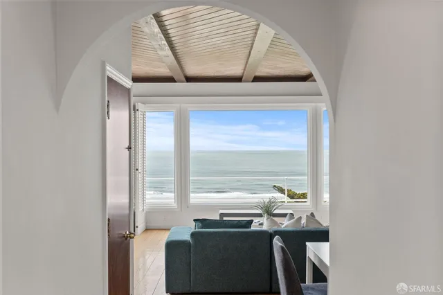 a view of a city from a corridor