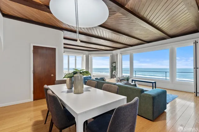 a view of living room with furniture and window