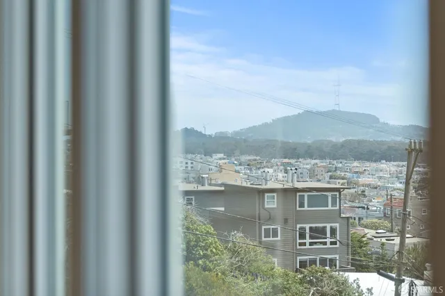 a kitchen with stainless steel appliances granite countertop a stove a refrigerator and a microwave