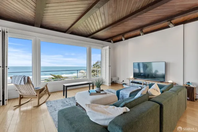 a bedroom with a bed and chair