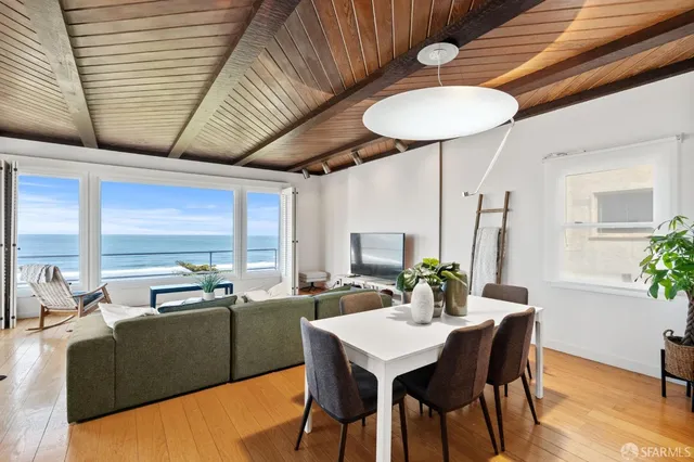 a bed room with a bed and a lamp next to a window