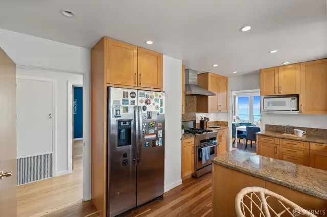 a bathroom with a bathtub a sink and a mirror