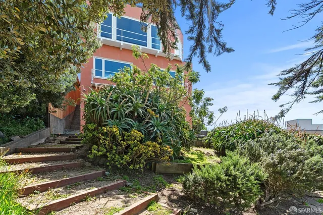 a front view of a house with parking