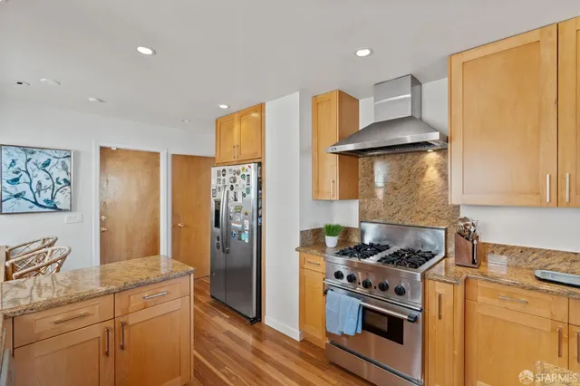 a bedroom with furniture and wooden floor