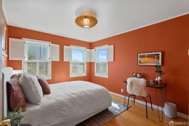 a work room with furniture and a potted plant