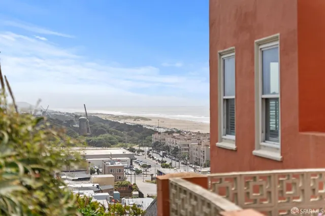 a view of a hallway with bathroom and small space