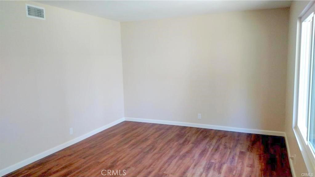 8 Sage Irvine, CA 92604 - Photo 2 of 32 a view of an empty room with wooden floor and a window