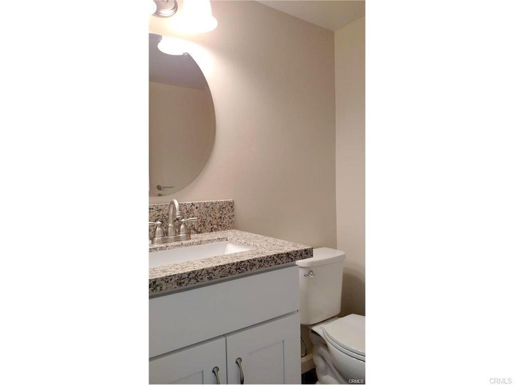 8 Sage Irvine, CA 92604 - Photo 6 of 32 a bathroom with a sink and a mirror