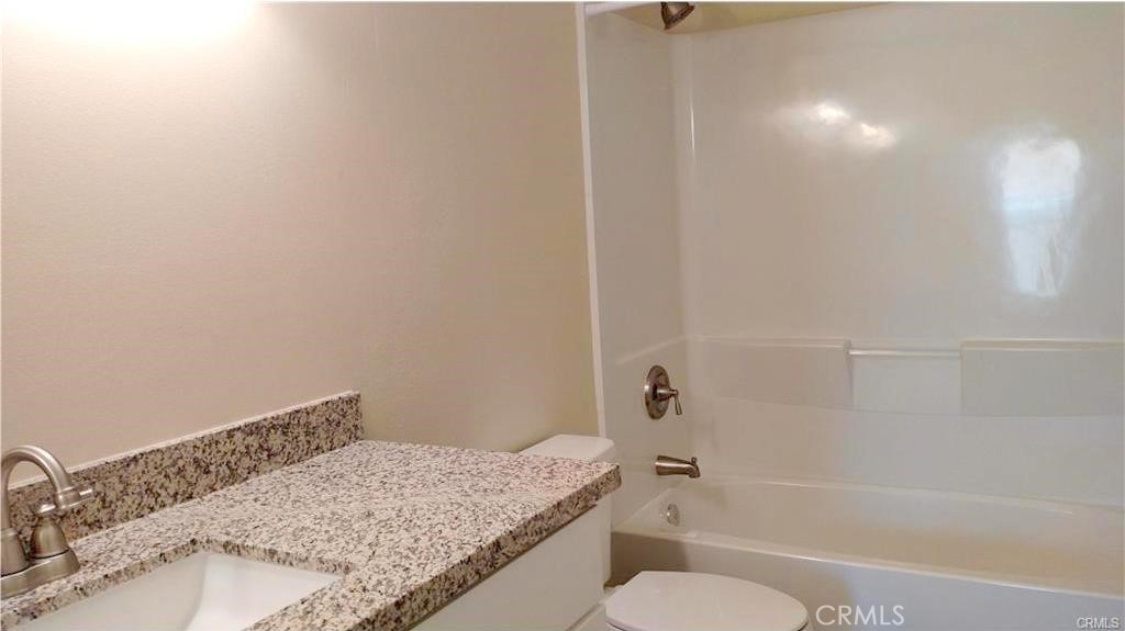 8 Sage Irvine, CA 92604 - Photo 9 of 32 a bathroom with a granite countertop sink toilet and bathtub