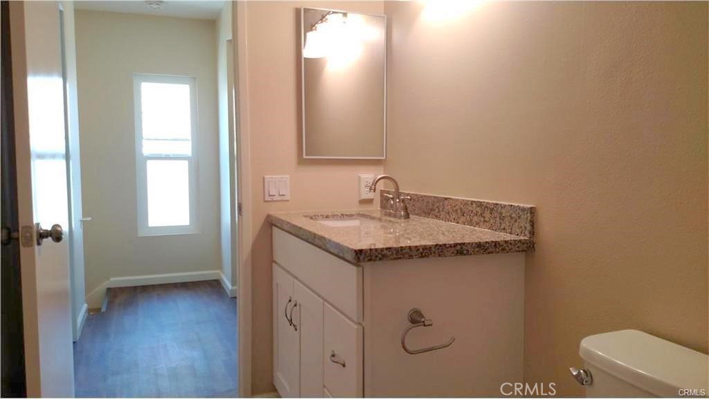 8 Sage Irvine, CA 92604 - Photo 10 of 32 a bathroom with a granite countertop sink and a mirror