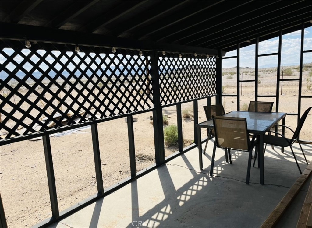 0 Blower Road Twentynine Palms, CA 92277 - Photo 6 of 12 a view of a chairs and table in the balcony