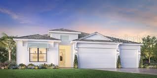 1878 Havenly Ridge Palm Harbor, FL 34683 - Photo 1 of 1 a front view of a house with a yard