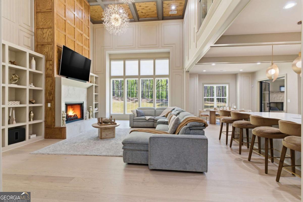 1315 Sandy Creek Road Tyrone, GA 30290 - Photo 21 of 100 a living room with fireplace furniture and a flat screen tv