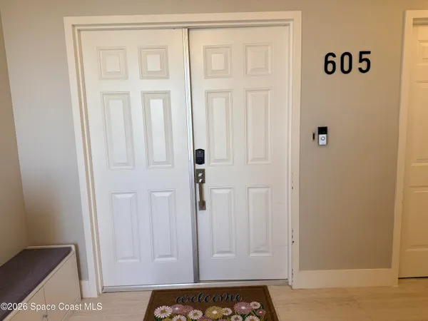a large kitchen with cabinets and stainless steel appliances