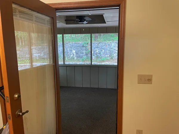 a view of an empty room with a window