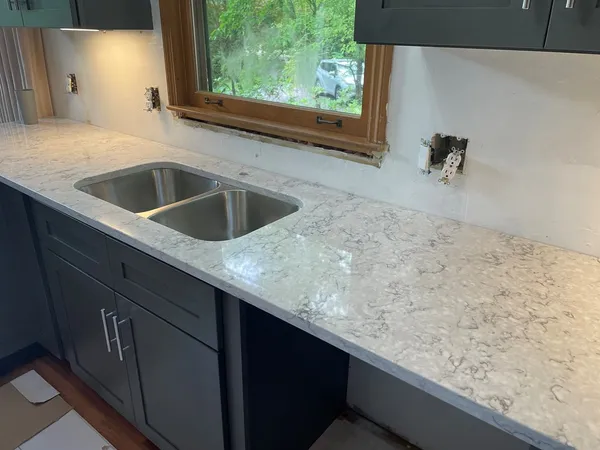 a kitchen with a sink and a window