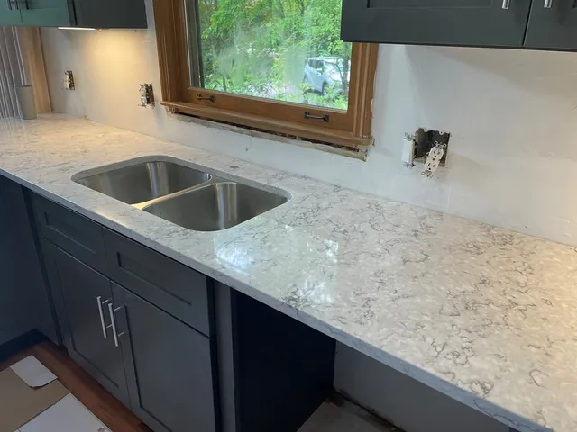 a kitchen with a sink and a window
