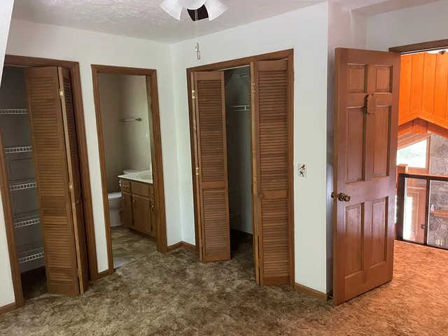 a view of a hallway with a room