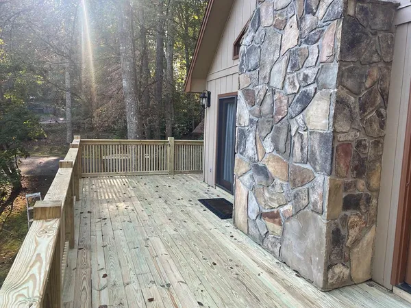a view of balcony with wooden floor