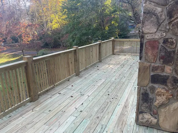 a view of a pathway with a wooden fence