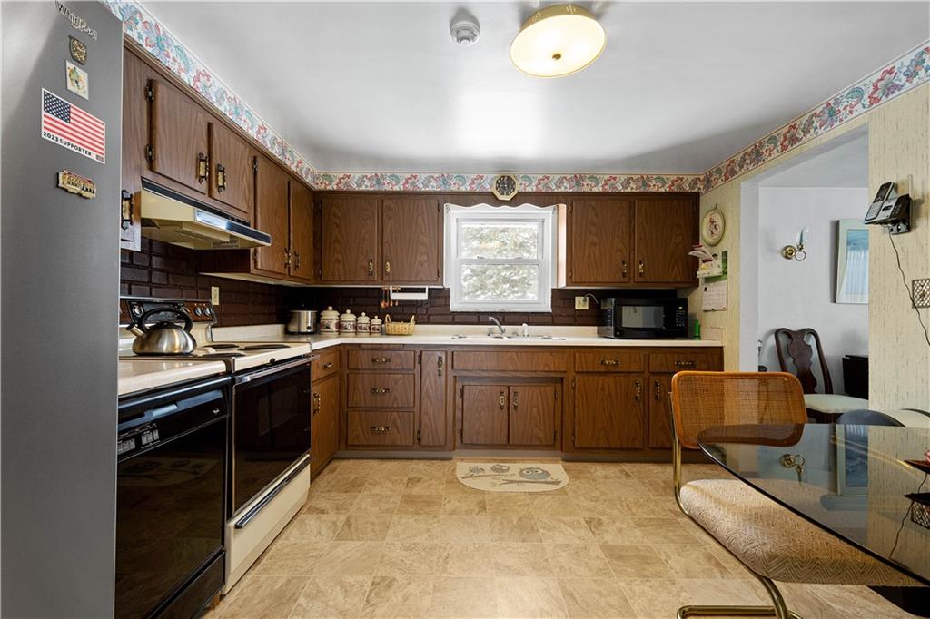 3157 Old Oakdale Road McDonald, PA 15057 - Photo 11 of 39 a kitchen with stainless steel appliances granite countertop a sink and cabinets