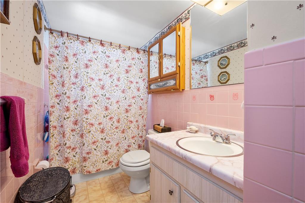 3157 Old Oakdale Road McDonald, PA 15057 - Photo 14 of 39 a bathroom with a sink toilet and shower